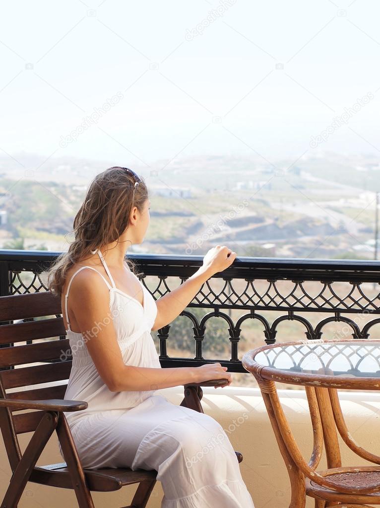 Young attractive pregnant woman chilling at the turist resort