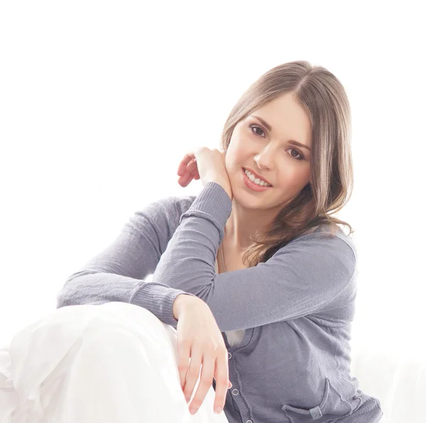 Young attractive girl on the sofa — Stock Photo, Image