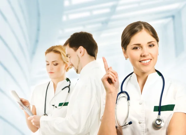 Team of young and smart medical workers isolated on white — Stock Photo, Image