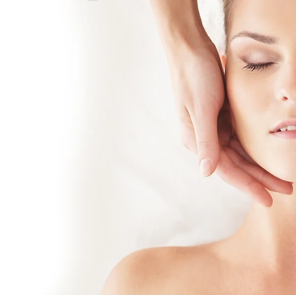 Young attractive woman getting spa treatment over white backgrou — Stock Photo, Image