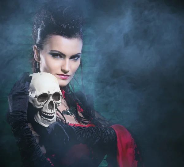 Halloween concept: young and sexy lady vampire in the dungeon — Stock Photo, Image