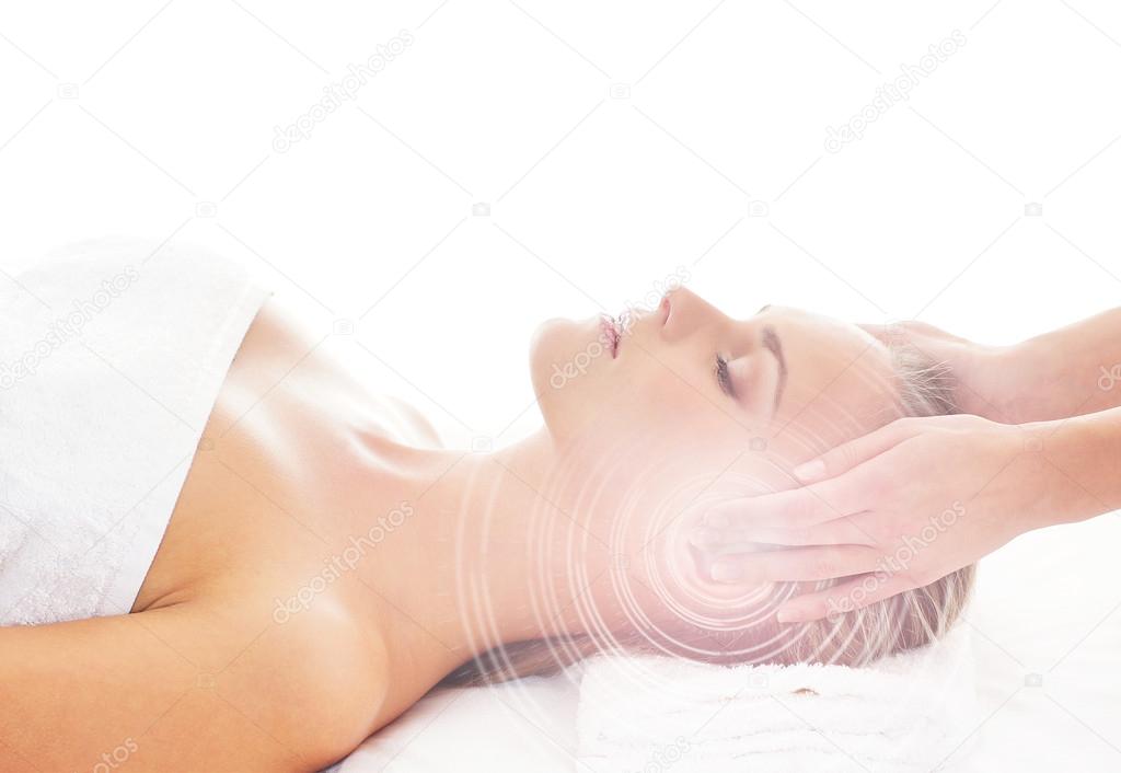 Young attractive woman getting spa treatment over white backgrou