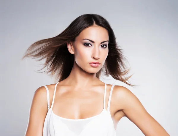 Glamour portrait of a young brunette woman in makeup Stock Image