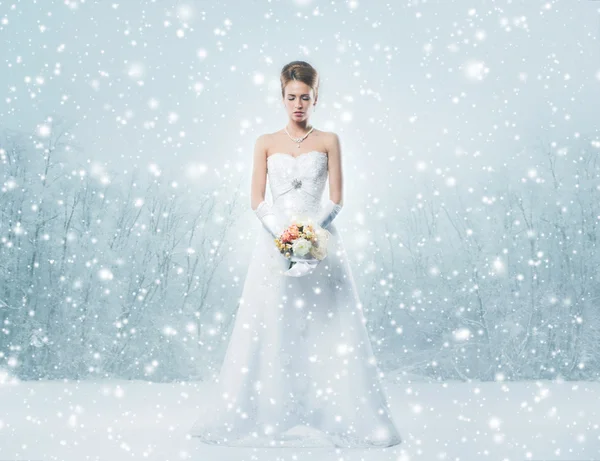 Young and beautiful bride standing with the flower bouquet over — Stock Photo, Image