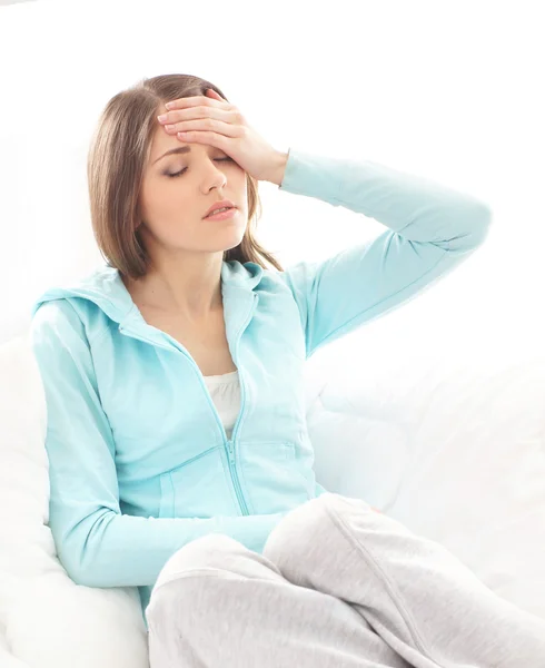 Young woman suffering of the pain over white background — Stock Photo, Image