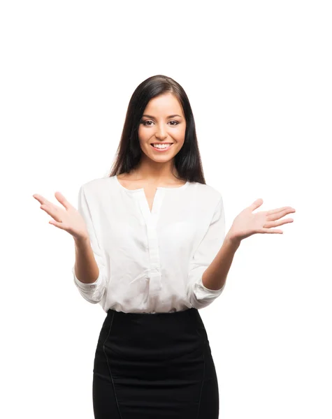 A young businesswoman pointing at something on white — Stock Photo, Image