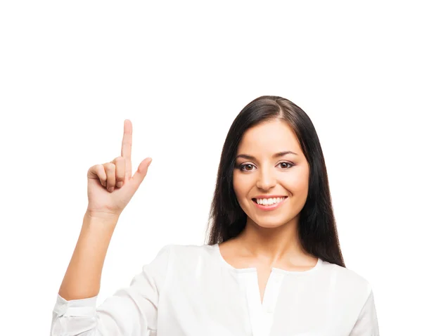 A young businesswoman pointing at something on white — Stock Photo, Image