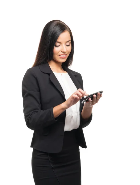 Une jeune femme d'affaires avec un smartphone sur blanc — Photo