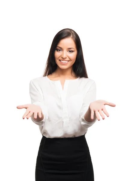 A young businesswoman pointing at something on white — Stock Photo, Image
