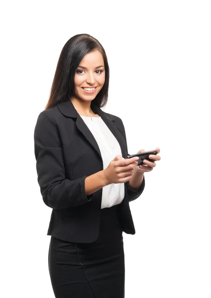 A young businesswoman with a smartphone on white — Stock Photo, Image