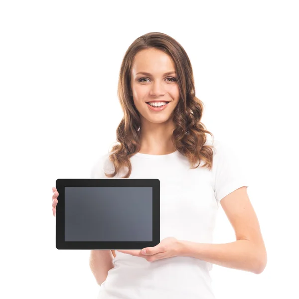 Портрет дівчини-підлітка, що тримає планшетний комп'ютер на білому Ліцензійні Стокові Фото
