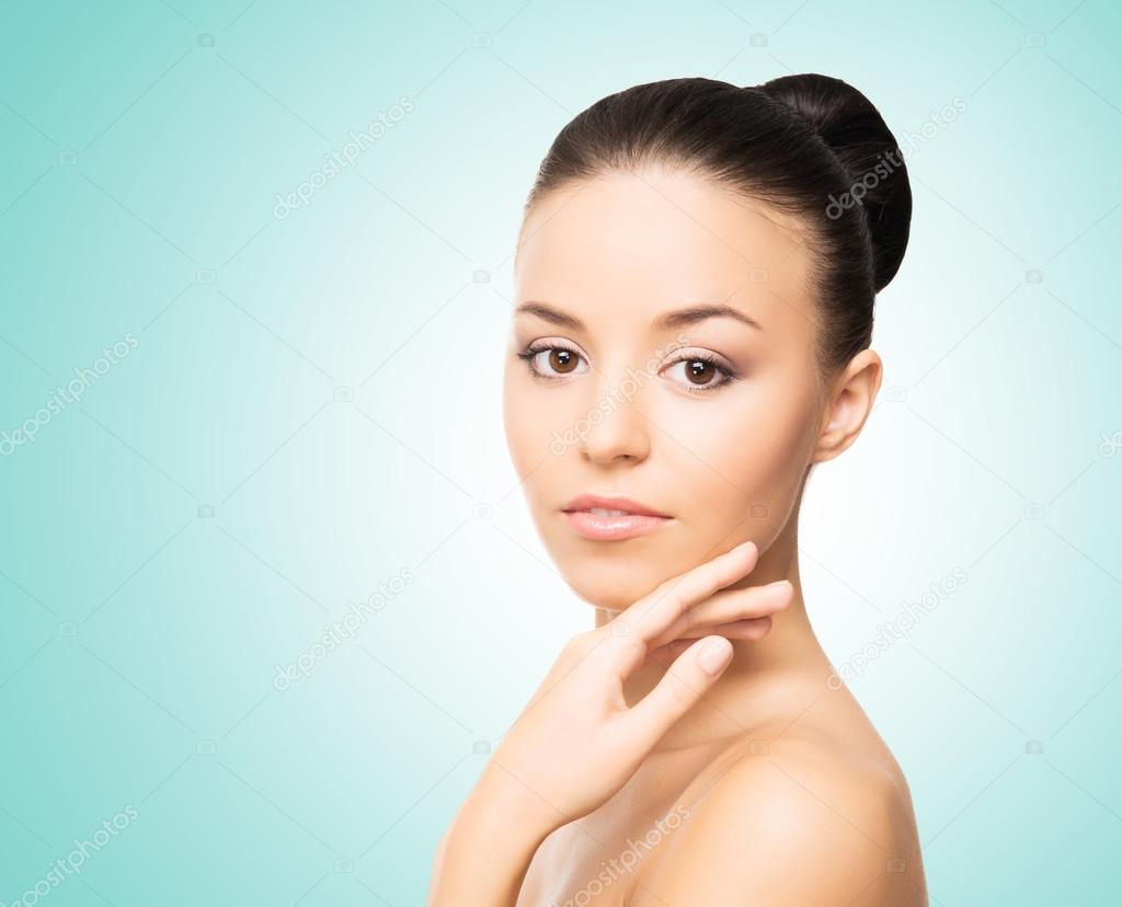 Portrait of a young woman in light makeup after taking a bath