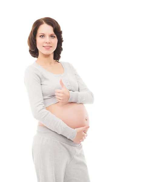 Une jeune femme enceinte brune isolée sur fond blanc — Photo