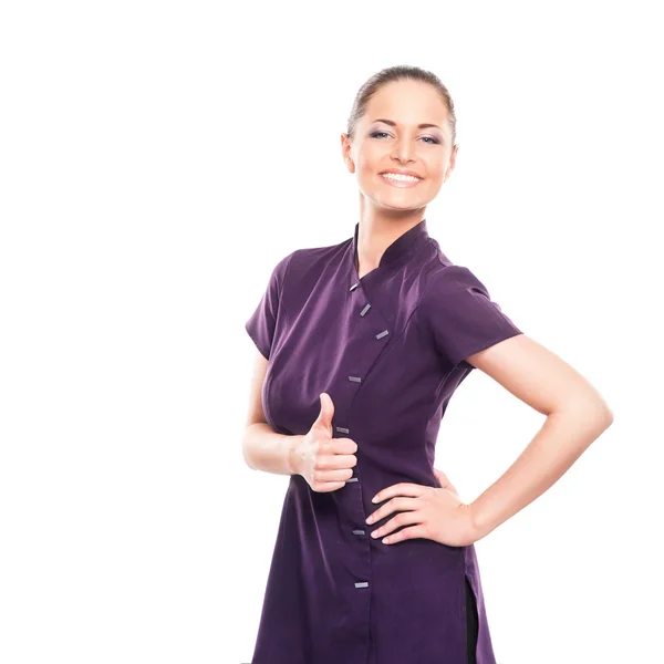 Молодая женщина в фиолетовой униформе, изолированная на белом — стоковое фото