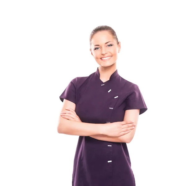 Uma jovem mulher em um uniforme roxo isolado em branco — Fotografia de Stock