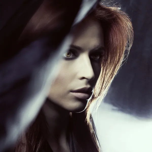 Attractive woman in darkness — Stock Photo, Image