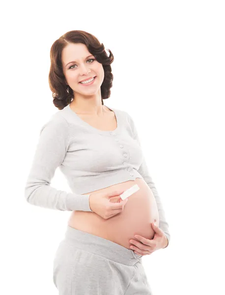 Pregnant woman with a pregnancy test — Stock Photo, Image