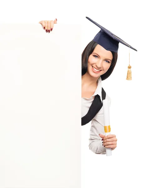 Graduate girl with a blank banner — Stock Photo, Image