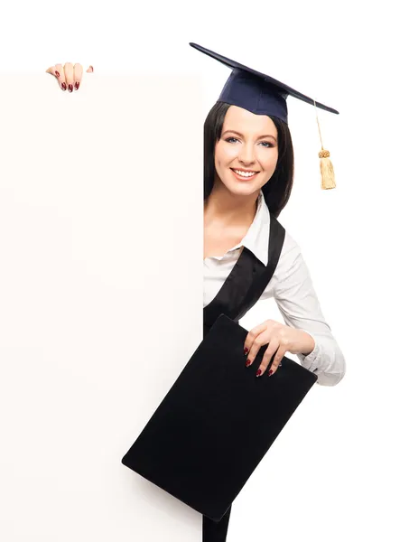 Graduate girl with a blank banner — Stock Photo, Image