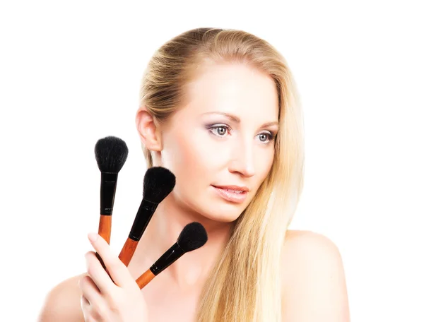 Mulher com as escovas de maquiagem Fotografias De Stock Royalty-Free