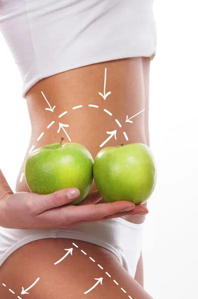 Diätkonzept, schöner Bauch und eine Frucht isoliert auf weiß — Stockfoto