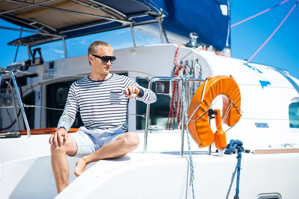 Handsome man on sailing boat — Stock Photo, Image