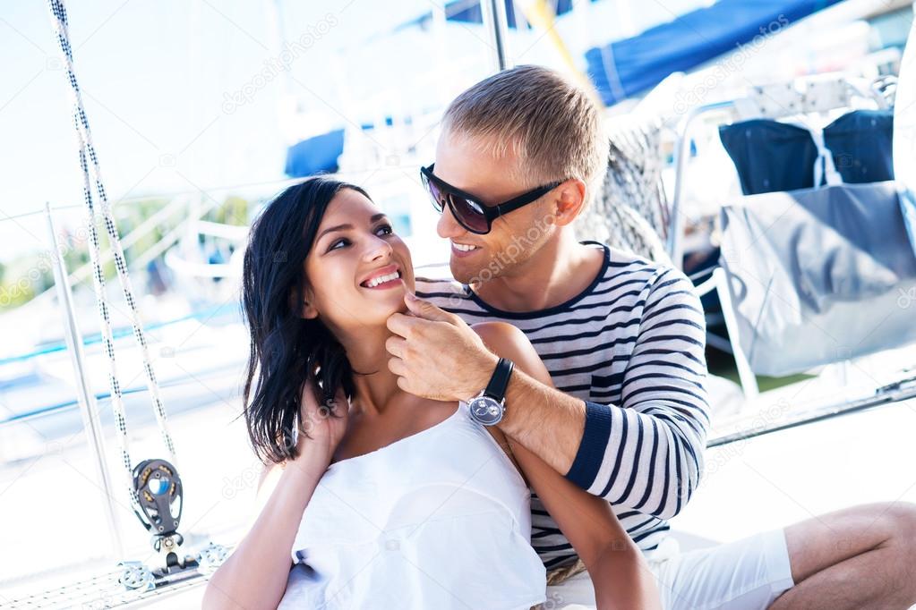 Attractive couple on sailing boat