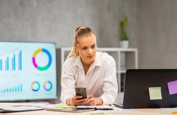 Workplace of freelance worker or a student girl at home office. Young woman works using computer and other devices. Remote job concept. — Stock Photo, Image