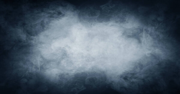Abstract smoke texture over black. Fog in the darkness.