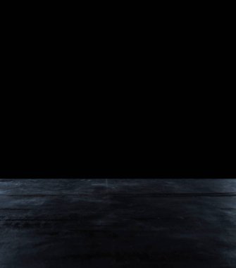 Karanlık bir arkaplanda soyut bir yüzey. Karanlıkta beton dokusu.