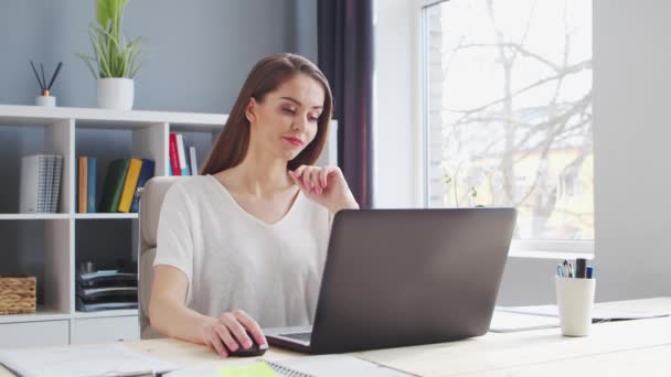 Young Woman Works at Home Office Using Computer. Workplace of Female Entrepreneur, Freelancer or Student. Remote Work and Education Concept. — Stock Video