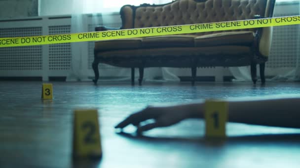 Closeup of a Crime Scene in a Deceased Persons Home. Dead man, Police Line, Clues and Evidence. Serial Killer and Detective Investigation Concept. — Wideo stockowe