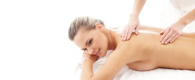 Young, beautiful and healthy woman in spa salon. Traditional massage therapy and skin care treatments. Healthcare and recreation concept.