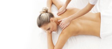 Young, beautiful and healthy woman in spa salon. Traditional massage therapy and skin care treatments. Healthcare and recreation concept.