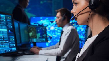 Workplace of the air traffic controllers in the control tower. Team of professional aircraft control officers works using radar, computer navigation and digital maps. The concept of aviation.