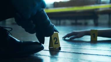 Detective Collecting Evidence in a Crime Scene. Forensic Specialists Making Expertise at Home of a Dead Person. The Concept of Homicide Investigation by Professional Police Officer.