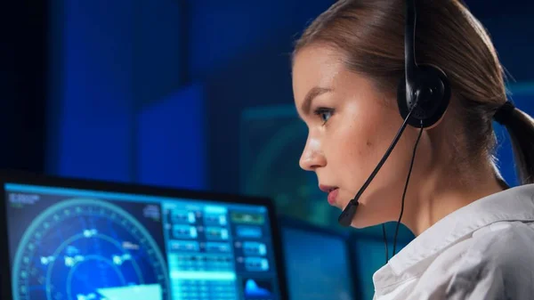 Workplace of the air traffic controllers in the control tower. Team of professional aircraft control officers works using radar, computer navigation and digital maps. The concept of aviation.