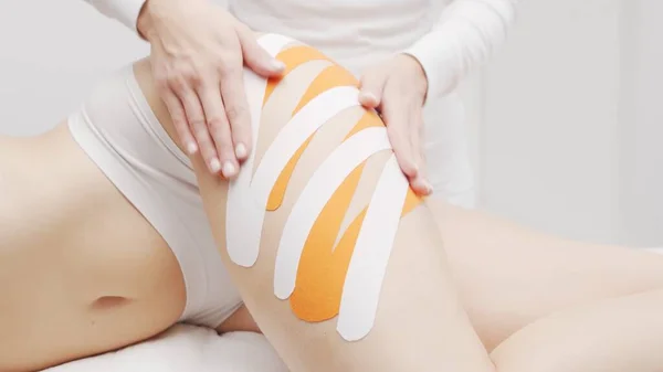 Therapist Applying Kinesio Tape Beautiful Female Body Physiotherapy Kinesiology Recovery — 图库照片