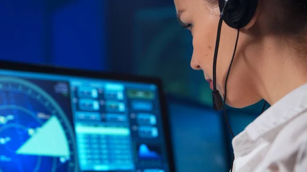 Workplace of the air traffic controllers in the control tower. Team of professional aircraft control officers works using radar, computer navigation and digital maps. The concept of aviation.