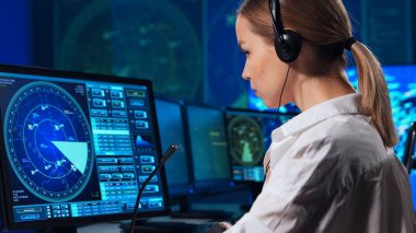 Workplace of the air traffic controllers in the control tower. Team of professional aircraft control officers works using radar, computer navigation and digital maps. The concept of aviation.