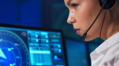 Workplace of the air traffic controllers in the control tower. Team of professional aircraft control officers works using radar, computer navigation and digital maps. The concept of aviation.