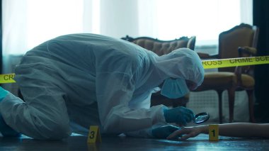 Detective Collecting Evidence in a Crime Scene. Forensic Specialists Making Expertise at Home of a Dead Person. The Concept of Homicide Investigation by Professional Police Officer.