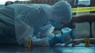 Detective Collecting Evidence in a Crime Scene. Forensic Specialists Making Expertise at Home of a Dead Person. The Concept of Homicide Investigation by Professional Police Officer.