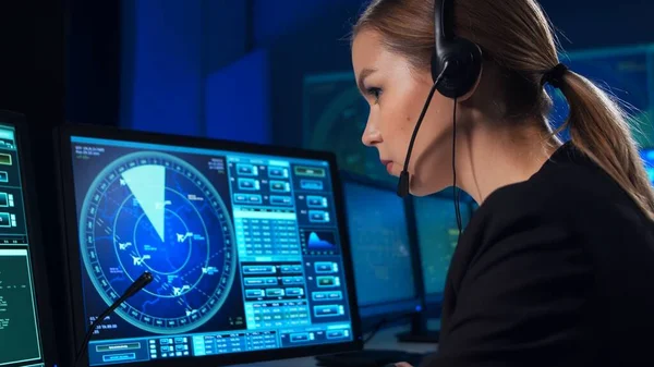 Workplace of the air traffic controllers in the control tower. Team of professional aircraft control officers works using radar, computer navigation and digital maps. The concept of aviation.