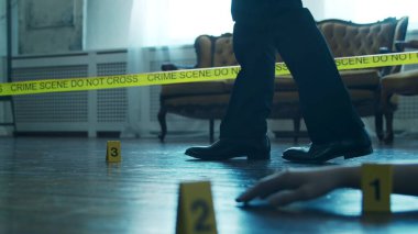Detective Collecting Evidence in a Crime Scene. Forensic Specialists Making Expertise at Home of a Dead Person. The Concept of Homicide Investigation by Professional Police Officer.
