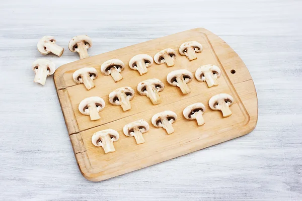 Mushrooms on cutting board — Stock Photo, Image