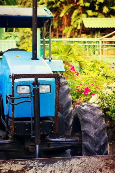 Tractor in a tropical garden — Stock Photo, Image