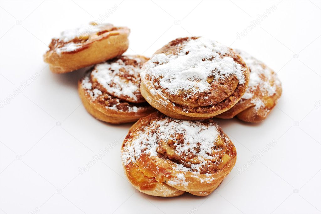 Buns with cinnamon on white background