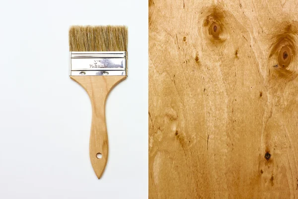 Renovation brush with paper and wooden texture — Stock Photo, Image