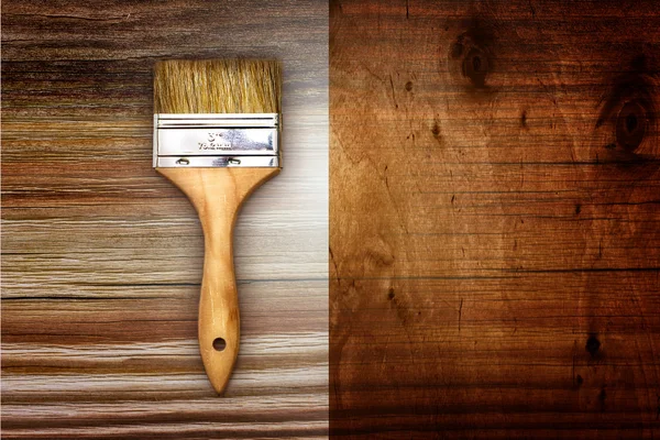 Renovation brush on wooden background — Stock Photo, Image